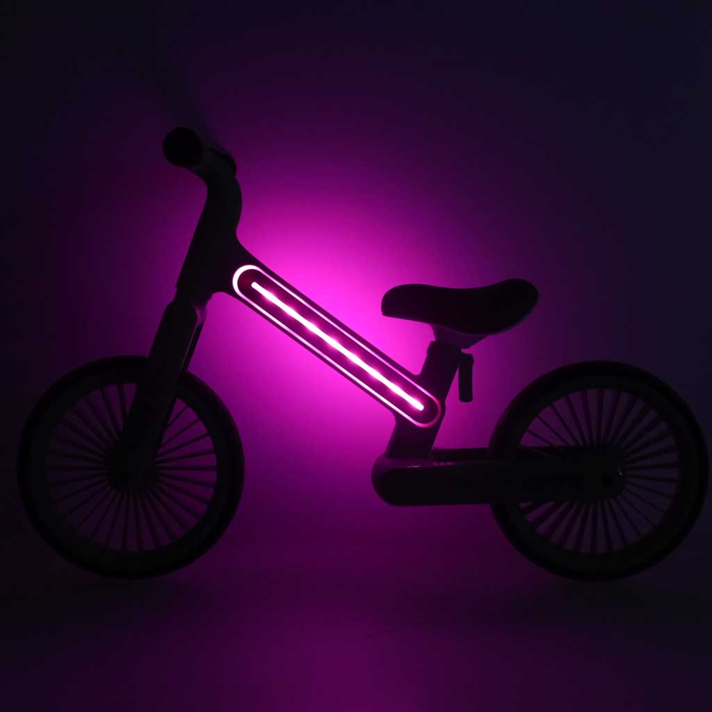 Bērnu līdzsvara velosipēds Trike Fix Glow rozā ar LED apgaismojumu tumšā vidē