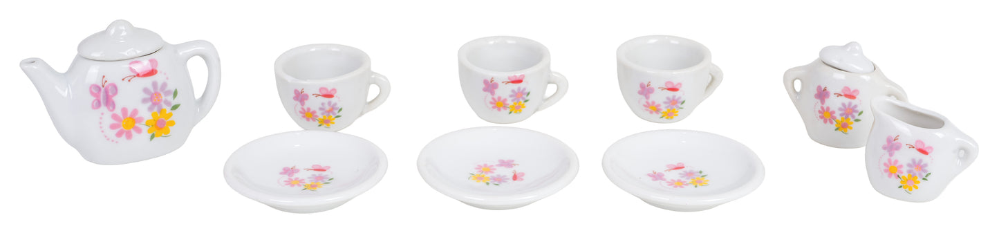 Porcelāna bērnu tējas servīzes komplekts – tējkanna, trīs tasītes ar apakštasītēm, cukurtrauciņš un piena krūzīte ar tauriņu un puķu rakstu.