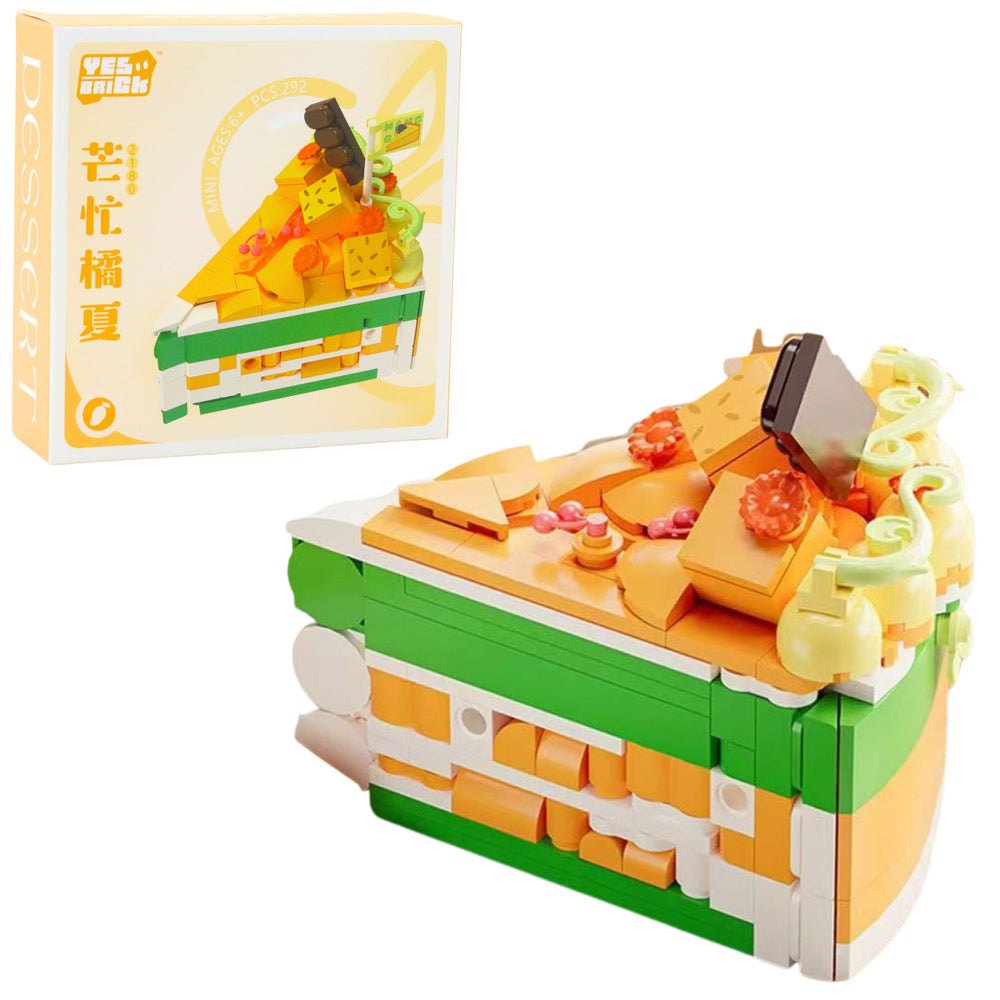Konstruktora deserts kūkas gabaliņa formā ar mango, apelsīnu un dekorācijām – 292 detaļas