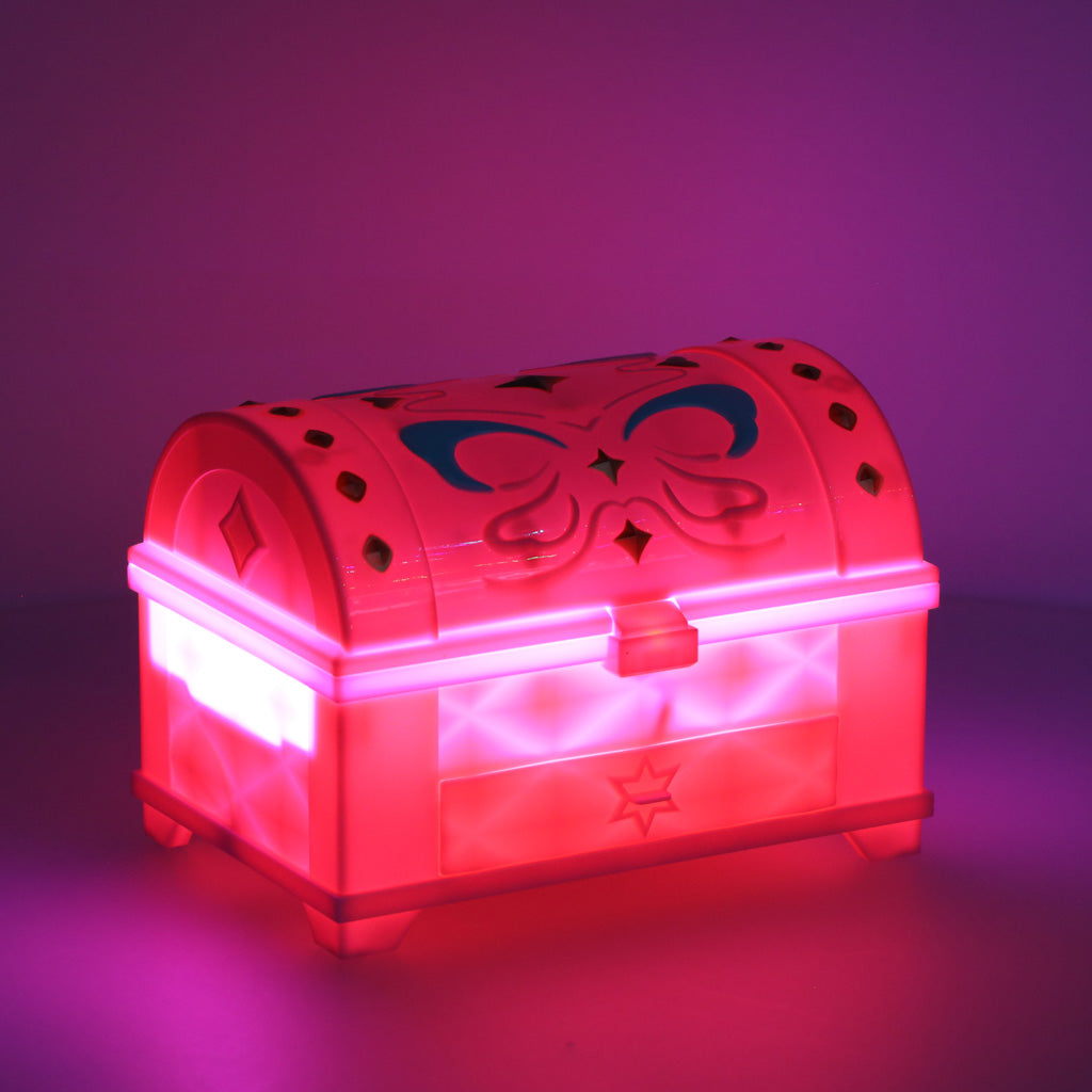 Rozā Magic Box rotaļlietu kaste tumsā spīd rozā un violetā UV gaismā