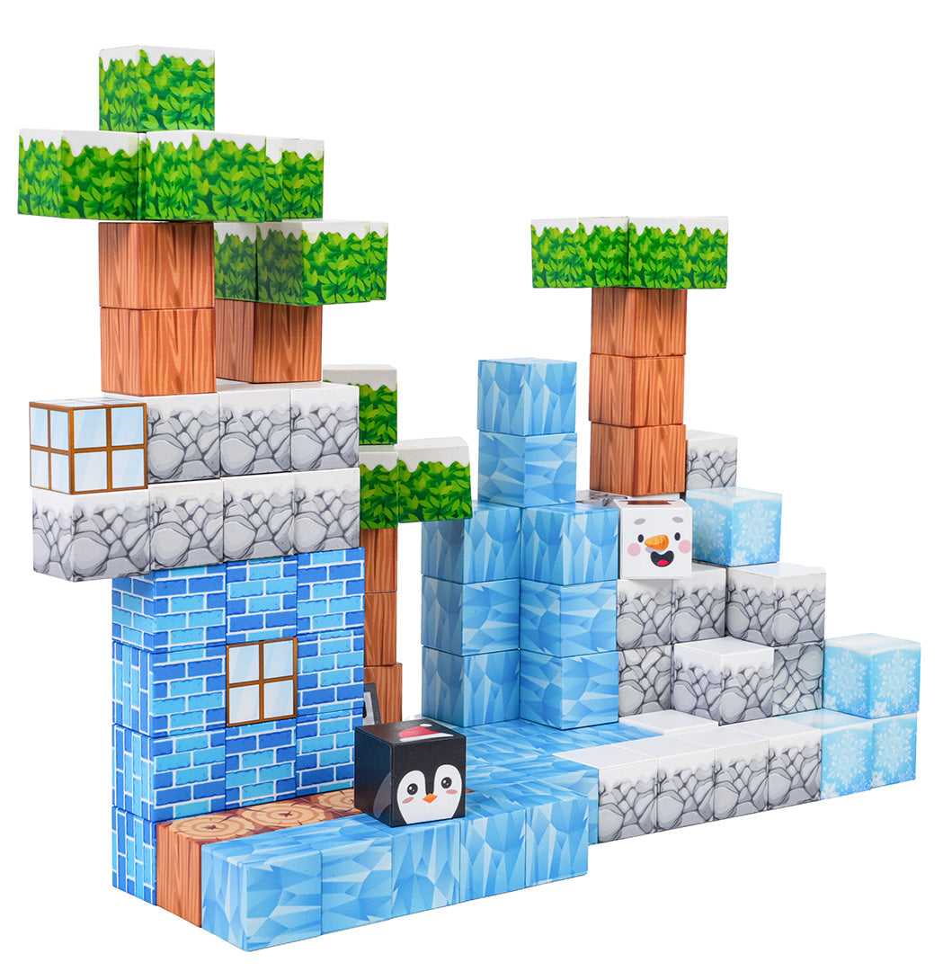 Magnētisko pikseļu kluču komplekts ar būvi ziemas ainavā, redzams ledus, koki, pingvīns un sniegavīrs