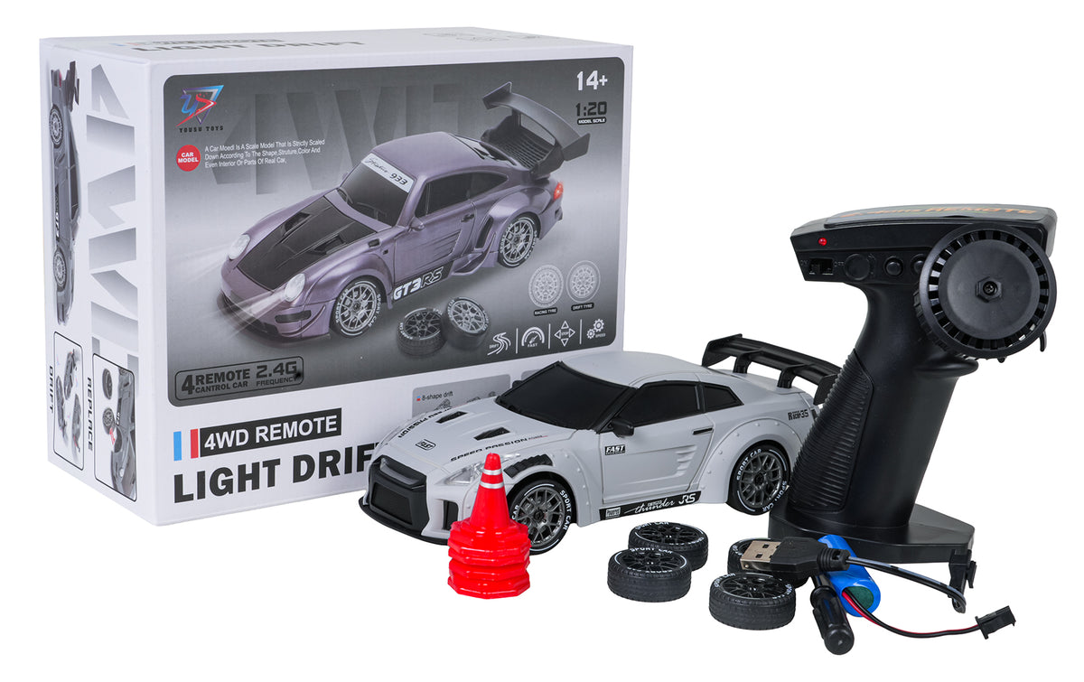 RC drifta auto 4WD balts ar tālvadības pulti, rezerves riepām, akumulatoru, konusiem un iepakojumu