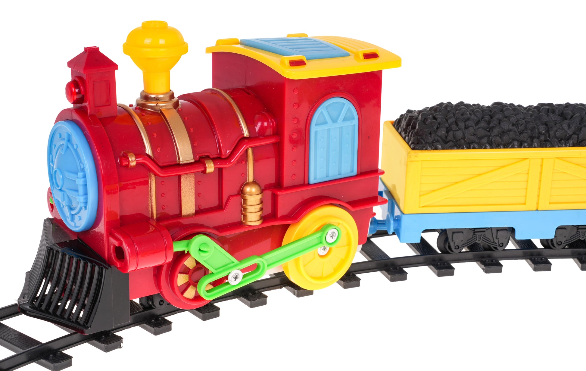 Krāsains rotaļu vilciena lokomotīves tuvplāns ar pieslēgtu ogļu vagonu uz sliedēm.