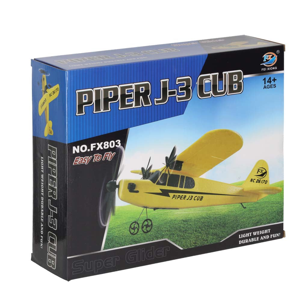 Tālvadības lidmašīna Piper J3 Cub dzeltenā krāsā uz produkta iepakojuma