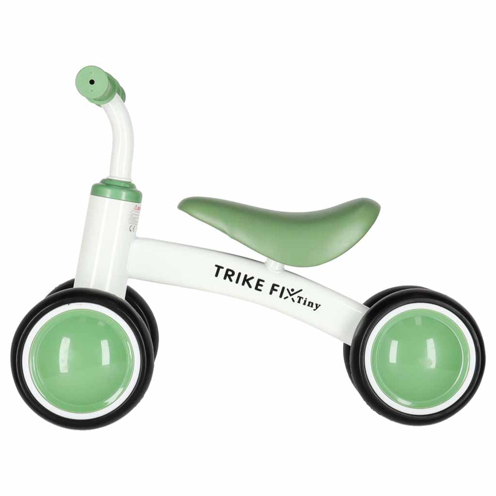 Zaļš Trike Fix Tiny V2 līdzsvara ritenis bērniem, sānskats no otras puses ar ergonomisku sēdekli