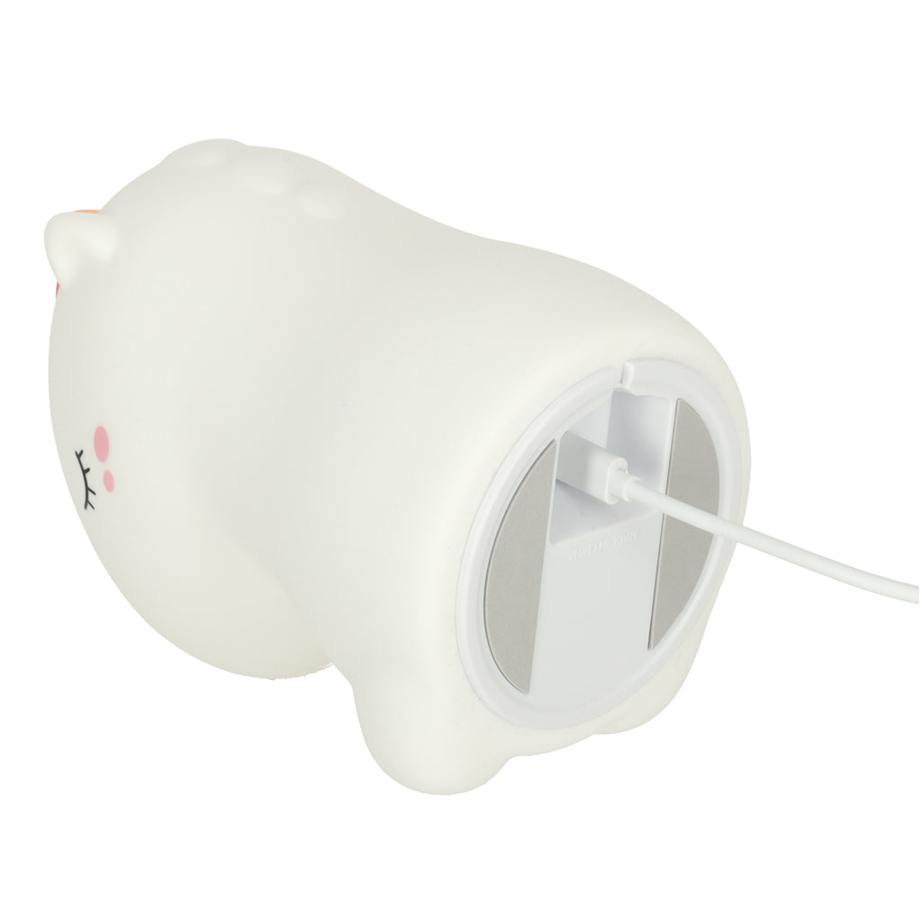 Uzlādes režīmā esoša vienradža silikona naktslampiņa ar pievienotu kabeli