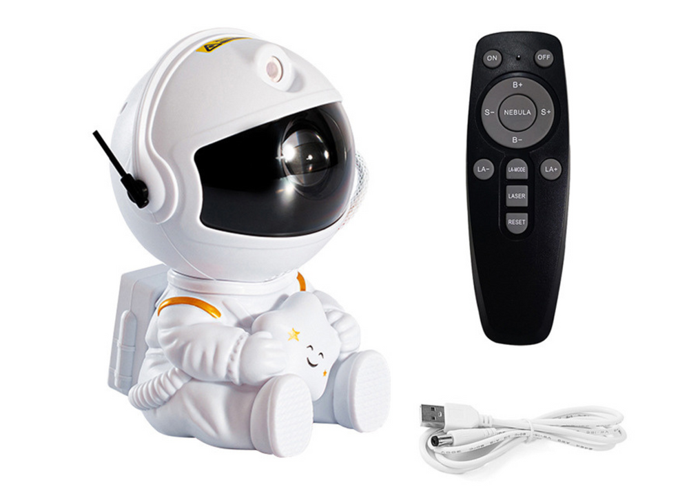 attēlots sēdošs zvaigžņu projektors astronauts ar talvadibas pulti un usb Balts fons